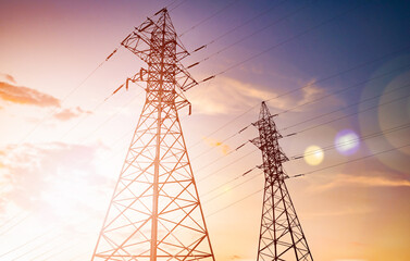 high-voltage power lines (power transmission tower) at sunset