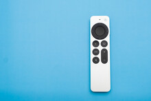 Siri Apple Tv 4k Remote controller on the blue background with copy space, February 2023, Prague, Czech Republic 