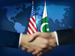 © Rumana - Two people shaking hands in front of American, and Pakistani flags.Pakistan, US bilateral relation concept background