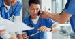© D Lahoud/peopleimages.com - Busy, phone call and doctor with medical paperwork, hospital chaos and anxiety from healthcare work. Clinic schedule, communication and Asian nurse with help from employees during overwhelming agenda