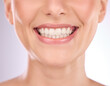 © Rethea B/peopleimages.com - Teeth, dental and oral hygiene with a model woman in studio on a gray background for tooth whitening. Dentist, healthcare and veneers with a female indoor to show a happy smile at a mouth specialist