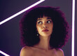 © Rethea B/peopleimages.com - Beauty, purple light and a woman in studio with neon uv for makeup, skin cosmetic and self love. Face of aesthetic gen z black person model on a background for natural afro or art glow and fashion