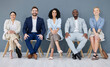 © Ilzer VH/peopleimages.com - Business, portrait and people in row waiting for interview, meeting or opportunity together. Smile, diversity group sitting in line for hiring, recruitment or recruiting candidates of human resources