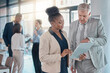 © Tamline L/peopleimages.com - Business people, leadership and clipboard in planning, idea or collaboration for team meeting at the office. Executives in strategy, project plan or schedule discussion for research or corporate data