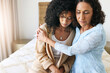 © Allistair F/peopleimages.com - Black women hug, comfort and sad with empathy, kindness and mental health, love with grief and loss. Depression, mother and adult daughter with compassion and care, family and support with trust