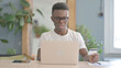 African Man Unable to make Online Payment on Laptop