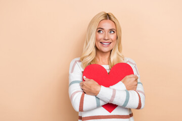 Sticker - Portrait of cheerful optimistic girl wavy hairdo wear striped pullover hug big heart look empty space isolated on pastel color background