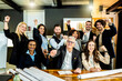© Davide Zanin - Multiethnic joyful business people looking at camera inside corporate office for a group photo while working together on sustainable innovation project - Goal achievement concept