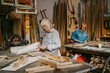 © Maskot - Senior craftswomen working together at repair shop