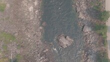Top Down Aerial Of Huge Boulder In Middle Of Salmon River In Idaho In Fall