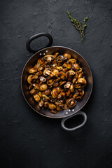 Wall Mural - Sauteed mushrooms with onion and thyme in frying pan, vegan meal