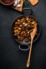 Wall Mural - Sauteed mushrooms with onion and thyme in frying pan, vegan meal