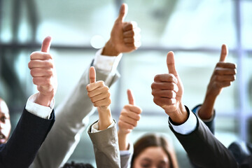 Leinwandbilder - Need we say more. Cropped shot of a group of businesspeople giving thumbs up in a modern office.
