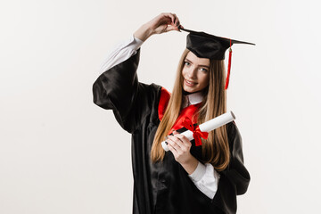 Wall Mural - Graduate girl graduated from university and got master degree. Graduation. Happy graduate girl smiling and holding diploma with honors in her hands on white background.