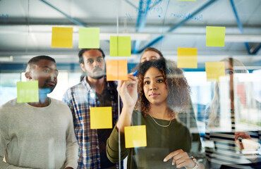 Aufkleber - Collaborating their way to a successful campaign. Shot of colleagues having a brainstorming session with sticky notes at work.