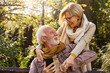 © lordn - Portrait of a beautiful senior couple in the public park. Early retirement