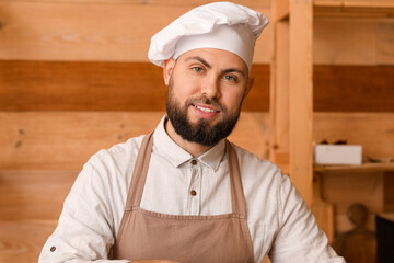 Canvas Print - Male baker cooking in kitchen, closeup