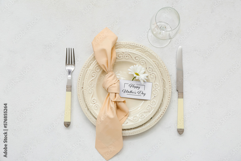 Stylish table setting for Mother's Day celebration on light background
