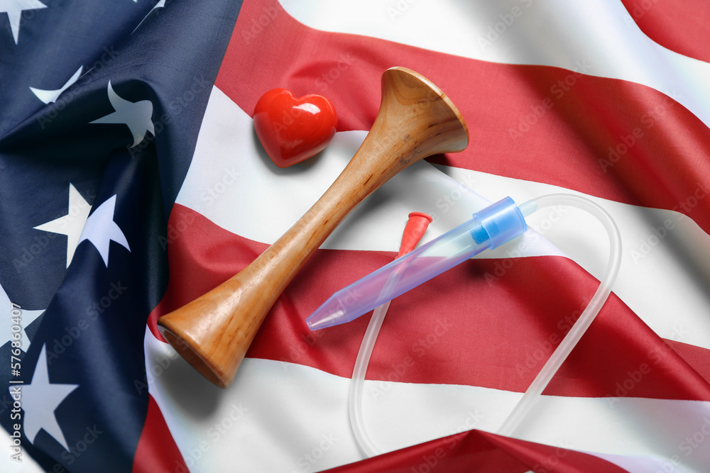 Stethoscope with nose aspirator and heart on USA flag
