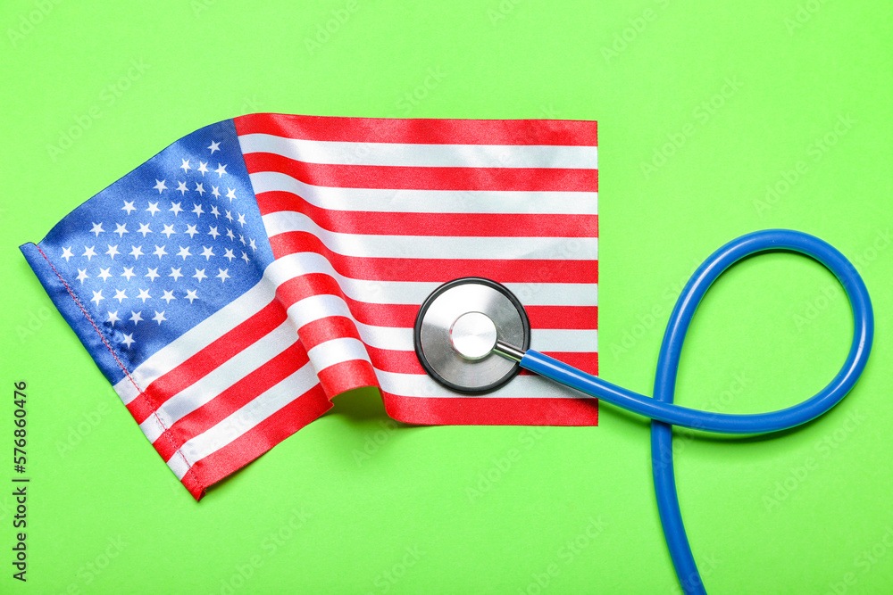Stethoscope with USA flag on green background