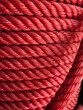 red color rope on reel , rope texture close up for background