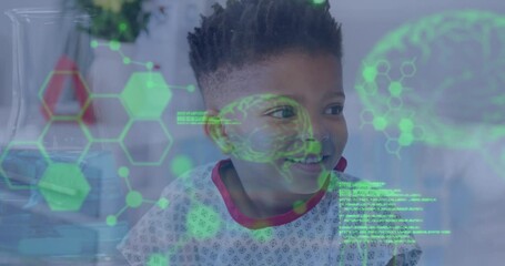 Sticker - Animation of medical data processing over biracial boy patient