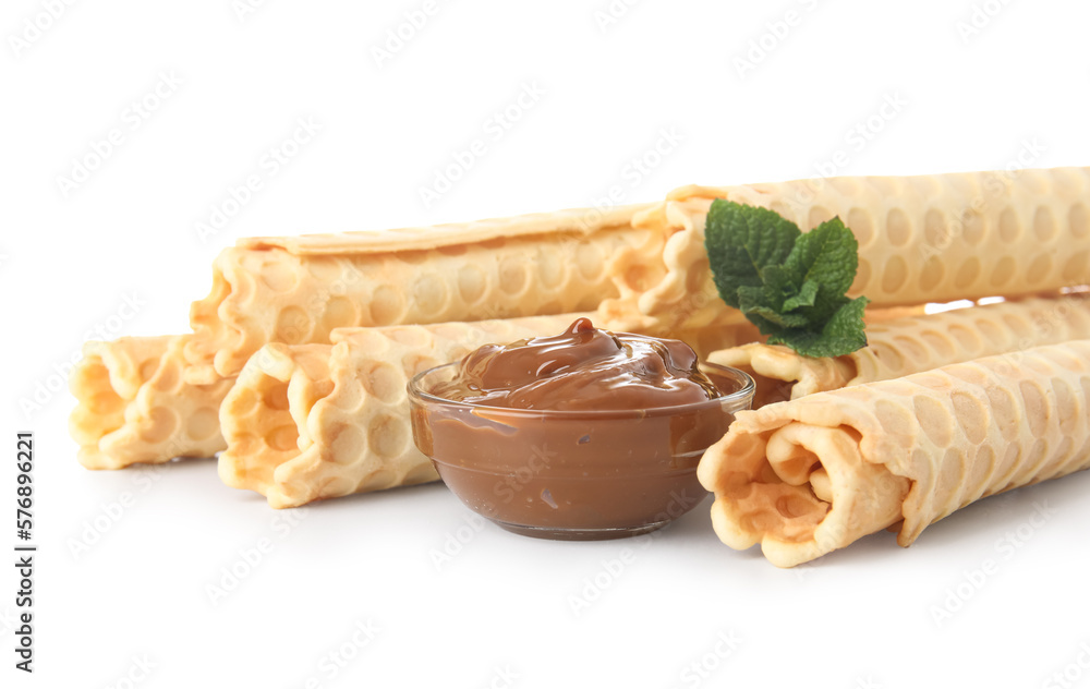 Delicious wafer rolls with mint and boiled condensed milk isolated on white background