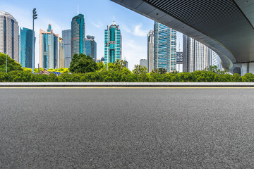 Wall Mural - empty asphalt road with city skyline background in china.