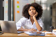 © David - Portrait of tired young business african american woman work with documents tax laptop computer in office. Sad, unhappy, Worried, Depression, or employee life stress concept