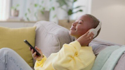 Sticker - Black woman on couch, headphones and smartphone with connection, relax and streaming music in lounge. African American female, lady and cellphone with headset, listening to sounds and radio for songs