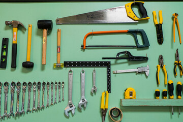 Wall Mural -  Handyman tool kit hanging in Garage at home,Various repair tools.