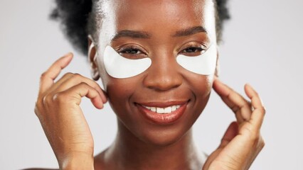 Wall Mural - Skincare, face and black woman with eye patches in studio isolated on a gray background. Dermatology portrait, beauty cosmetics and happy female model with facial collagen mask for healthy skin.