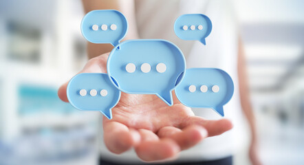 Wall Mural - Businessman using digital speech bubbles talk icons. Minimal conversation or social media messages floating over user hand. 3D rendering