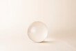 glass sphere on beige background