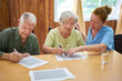 © Robert Kneschke - Geriatric nurse helps senior couple solve the puzzle