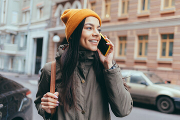 attractive young woman tourist talking on mobile phone