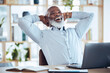 © Mumtaaz D/peopleimages.com - Happy black man stretching at desk for relax, online success and work life balance on office laptop. Business manager, boss or person success, calm and confident for project or career time management