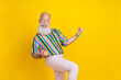 © deagreez - Photo of excited funky man wear colorful shirt rising fists screaming empty space isolated yellow color background