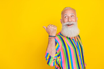 portrait of handsome positive old man with long beard wear colorful shirt indicating look empty spac