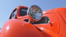 A Low Angle View Of A Retro Car Fender With Headlights.