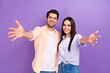 © deagreez - Photo of friendly students young people congratulate welcome meet miss you wear stylish casual outfit isolated on purple color background