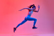 © master1305 - Dynamic portrait of young active girl, athlete, runner in motion, training over pink studio background in neon light. Concept of sportive lifestyle, health, endurance, action and motion. Ad