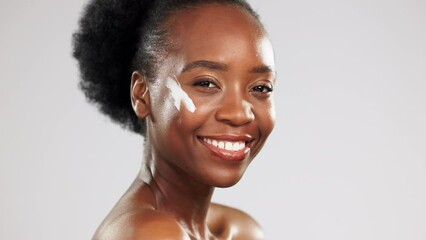 Canvas Print - Face, skincare and happy black woman with cream in studio isolated on a gray background. Dermatology portrait, cosmetics and laughing female model apply lotion, creme or moisturizer for healthy skin.