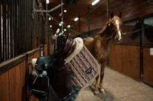 Selective Focus On Saddle In Contemporary Horse Stalls