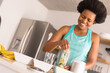 © Wavebreak Media - Cheerful mid adult african american woman preparing healthy breakfast in kitchen at home
