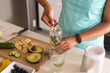 © Wavebreak Media - Midsection of mid adult african american woman preparing healthy breakfast in kitchen at home