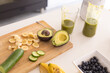 © Wavebreak Media - Fresh avocados and banana slices with healthy juice on kitchen island at home