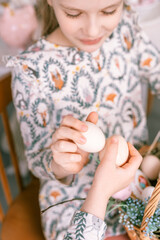 Wall Mural - easter holiday time in spring season. traditional children hands are shackling, jarping or dumping with eggs. happy family candid little kids sisters girls have fun at home. religious tradition