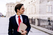 © ADDICTIVE STOCK - Entrepreneur with folder on street