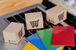 © Achira22 - Shopping online. Credit card and cardboard box with a shopping cart logo on laptop keyboard. Shopping service on The online web. offers home delivery.